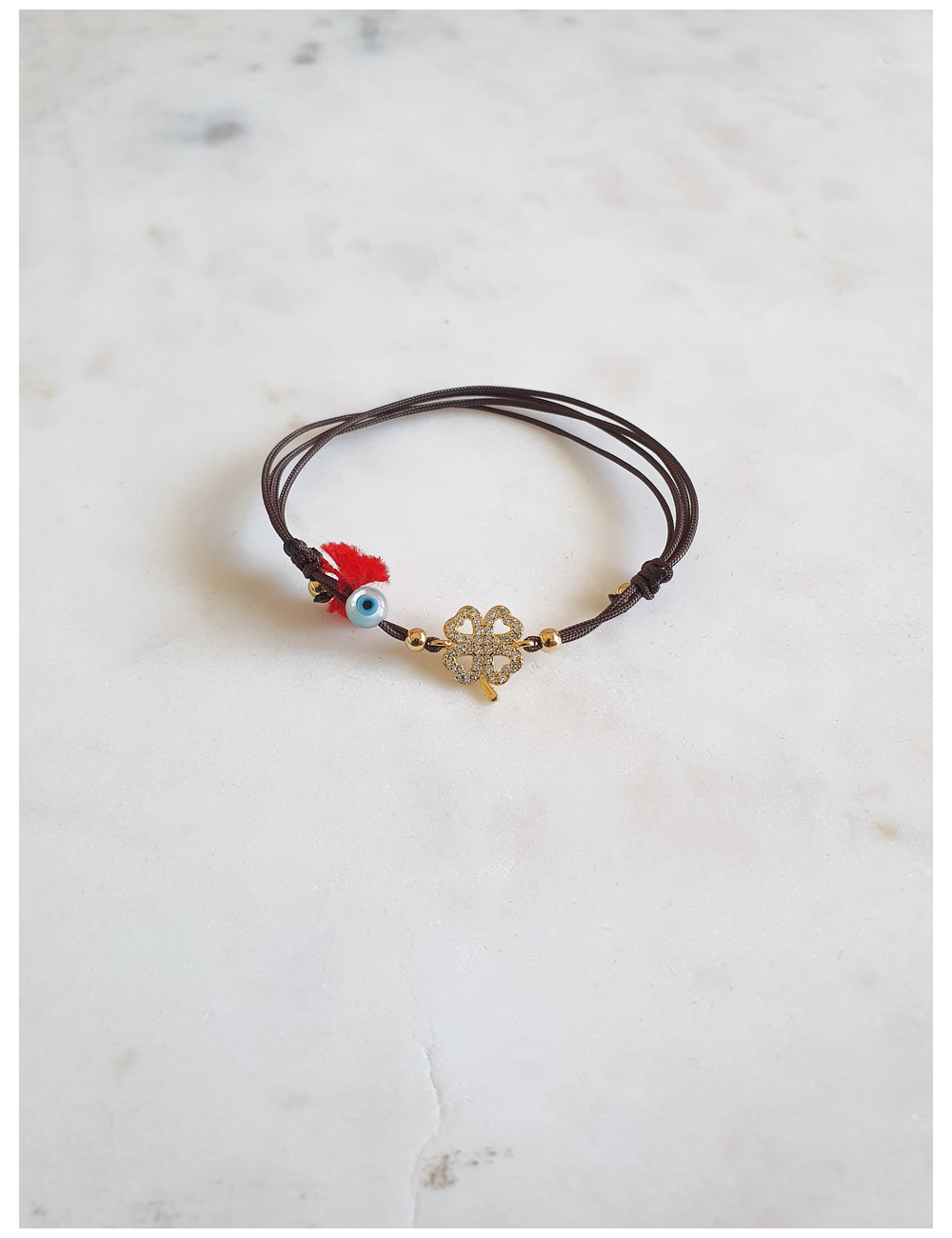 PULSEIRA EM FIO SEDA TREVO PRATA DOURADA