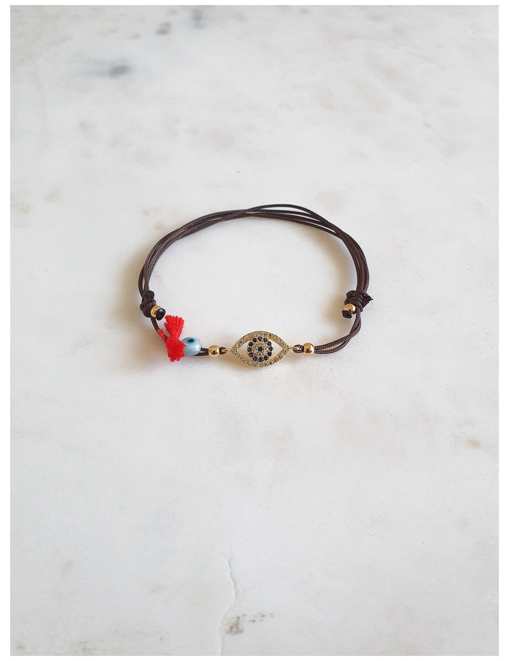 PULSEIRA EM FIO SEDA OLHO PRATA DOURADA